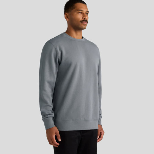 A grey jumper features a classic crew neckline and long sleeves, displayed on a male model. It includes a logo.