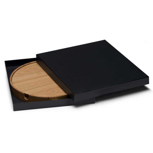 A round bamboo placemat with a black box for storage, featuring a sleek design and subtle branding.