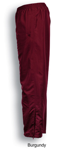 A pair of burgundy track pants featuring an elastic waistband and zippered cuffs, with a logo on the side.