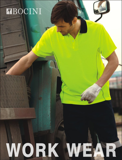 A bright yellow unisex polo shirt with black collar details, worn by a man next to a vehicle. The shirt features a logo.