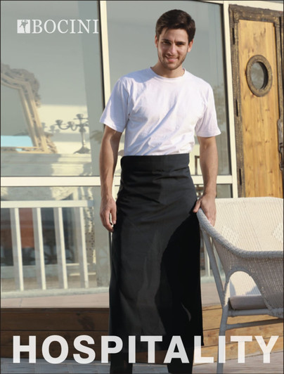 A man in a white shirt wears a black cotton drill apron with a pocket, standing outdoors. The image features a logo.