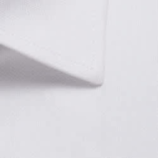 A close-up of a white button-up shirt collar featuring a textured fabric. The shirt has a clean, tailored appearance.