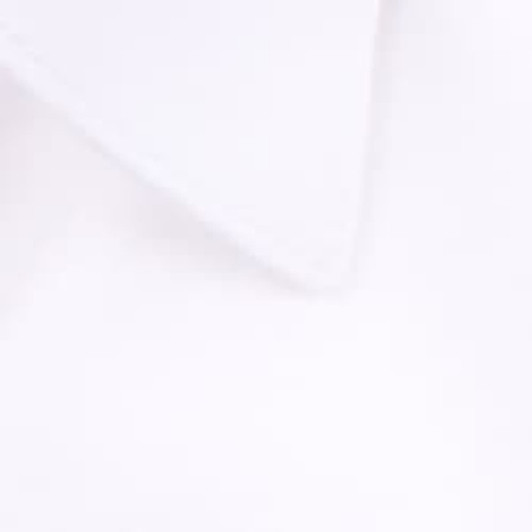 A close-up of a white button-up shirt collar with a smooth texture. The shirt features a logo.