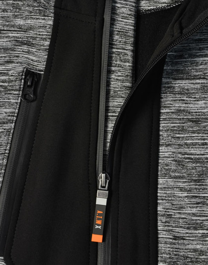 A grey and black jacket featuring a zippered front and a logo on the zipper pull.