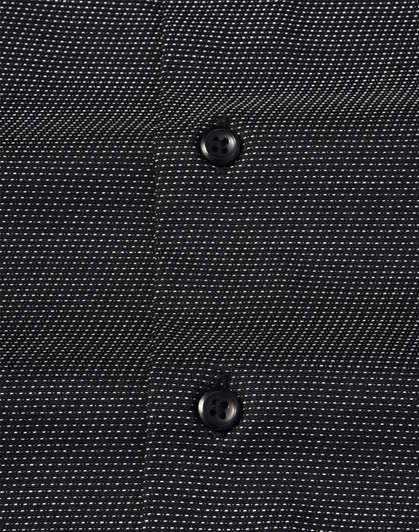 A black button-up shirt featuring a pin dot pattern and two buttons visible on the front. It has a logo.