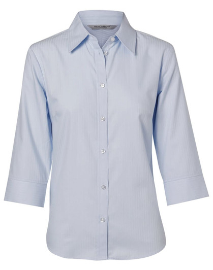 A light blue women's button-up shirt with 3/4 sleeves and a herringbone pattern, featuring a logo on the label.