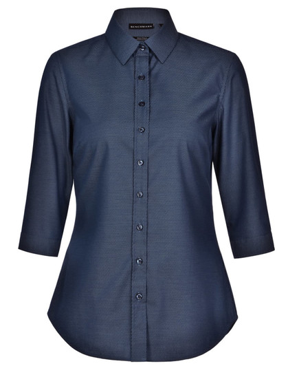 A dark blue ladies' pin dot button-up shirt with 3/4 sleeves and a collar, featuring a logo.