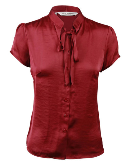 Red satin blouse with short sleeves and a tie neck detail, featuring a button-down front and a logo at the collar.