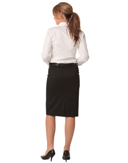 A black mid-length lined pencil skirt in poly/viscose stretch, paired with a white shirt and heels, viewed from the back.