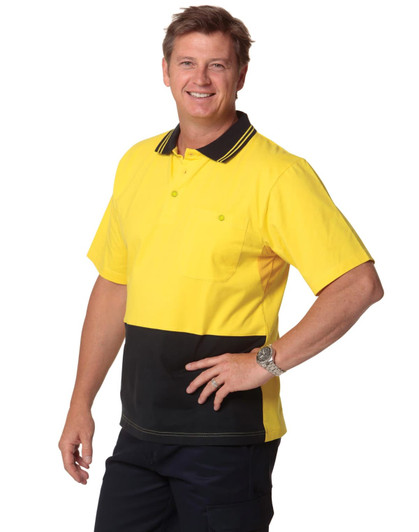 A man wearing a yellow and black two-tone safety polo shirt with a collar and pocket, featuring a branding logo.