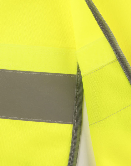 A bright yellow safety vest featuring grey shoulder reflective tapes and a logo. Suitable for high visibility in safety wear.