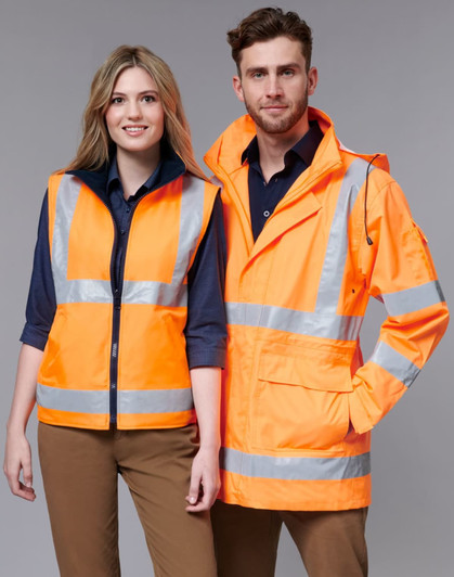 A safety jacket in bright orange with reflective stripes, displayed on two models, one male and one female.