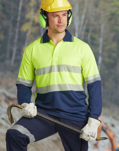 A bright yellow and navy long-sleeve safety polo shirt with reflective stripes, worn by a worker in safety gear.