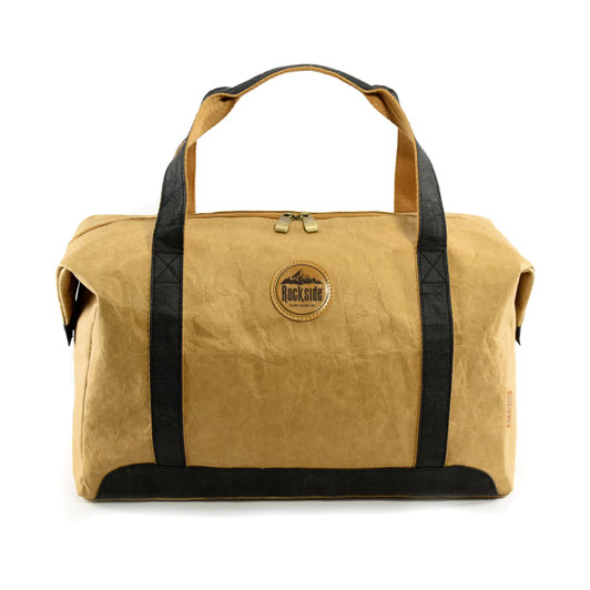 A brown kraft paper duffle bag with black handles and a circular logo. Zippered top closure included.