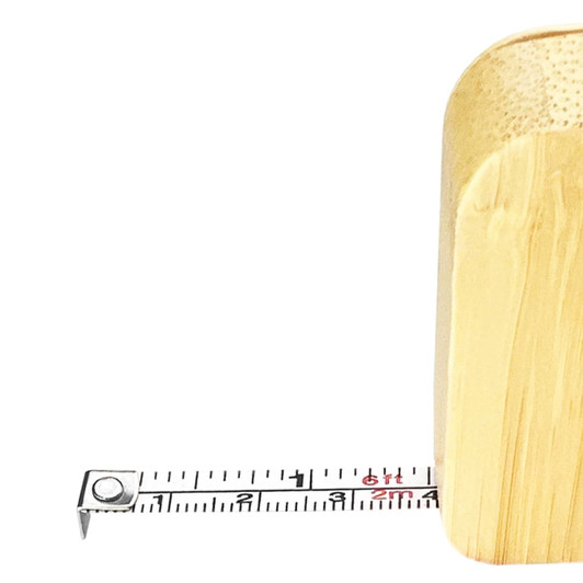 A bamboo tape measure key ring in natural brown, with a visible retractable tape marked in centimetres.