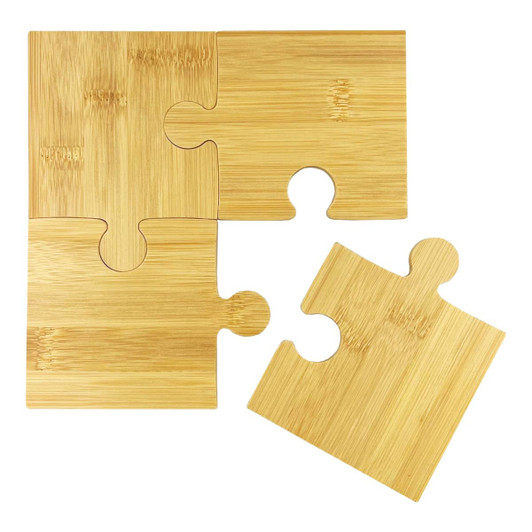 A bamboo coaster set featuring four interlocking puzzle pieces in a natural finish.