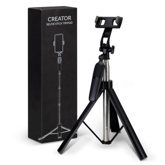 A black selfie stick tripod with a phone holder, next to its packaging, also in black.