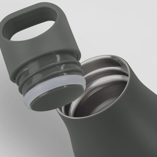 A drink bottle in a dark green colour with a silver interior and a removable lid featuring a handle.