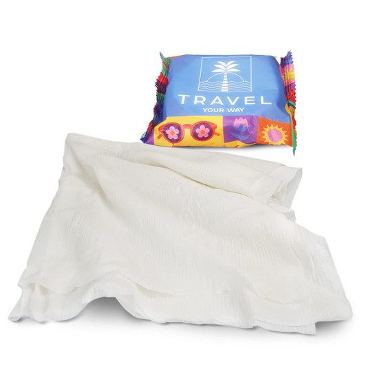 A compressed towel in white, presented in colourful packaging featuring a logo.