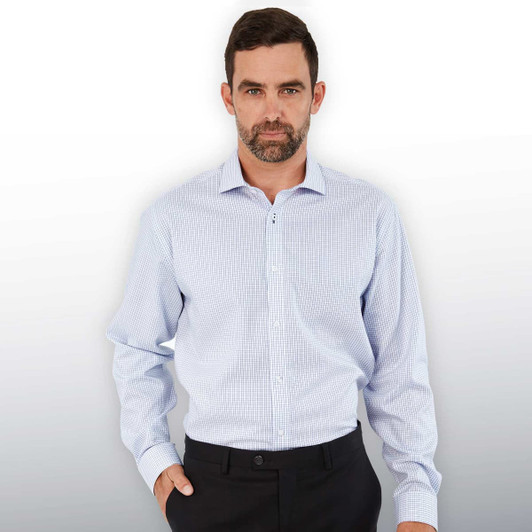 A button-up shirt in light blue with a check pattern, featuring long sleeves and a standard collar. It has a logo.