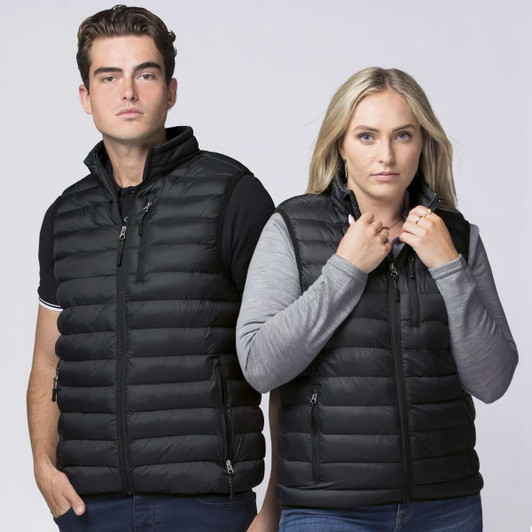 A black puffer vest worn by two models, styled with a grey long-sleeve top and featuring a logo.