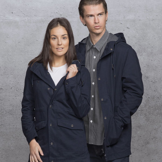 A navy twill jacket with a hood, featuring pockets and a stylish design. Includes a logo on the garment.