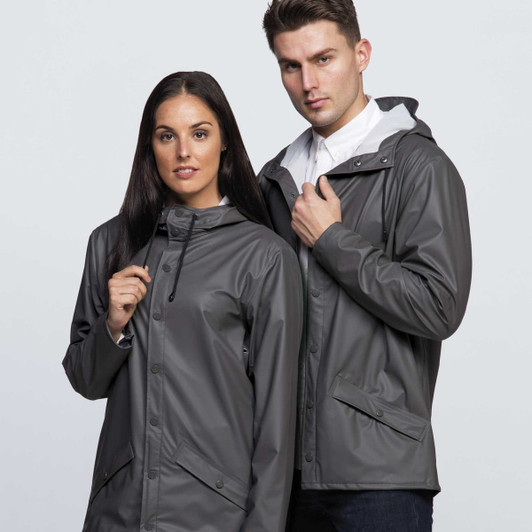 A grey rain jacket worn by a man and woman, featuring a hood and buttons, with a logo present.