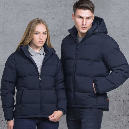 Two models wear navy blue smpli Terrain Puffa Jackets, showcasing a sleek design with hoods and zippers.