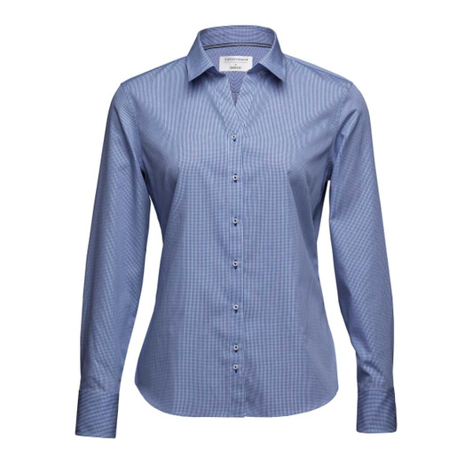 A women's button-up shirt in a light blue hue with a fitted style and long sleeves, featuring branding.