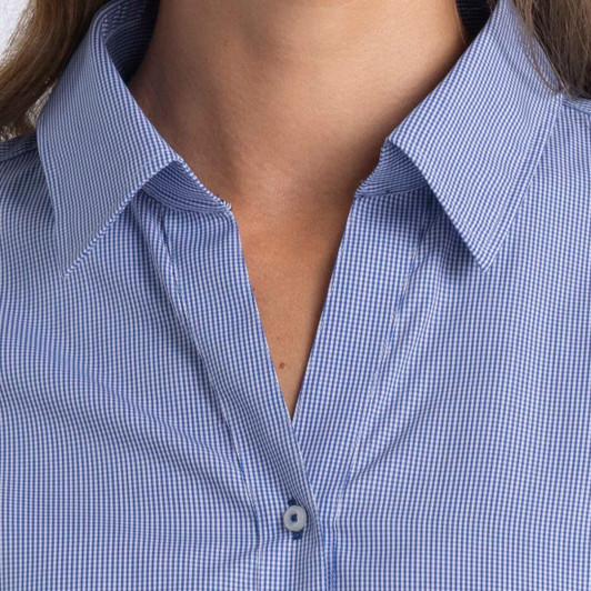 A women's button-up shirt in blue and white check pattern, featuring a collar and button closure. It has a logo.