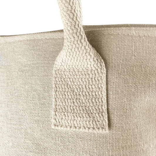 A cotton cooler bag in natural beige with a textured handle, featuring a minimalist design.