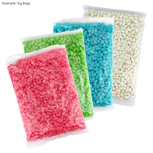Four clear bags of jelly beans in pink, green, blue, and white, displayed together. Each bag appears to contain 1 kg.