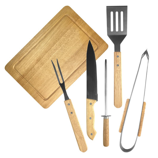 A BBQ set featuring wooden-handled tools: a spatula, tongs, a fork, a knife, and a sharpening rod, all on a wooden board.