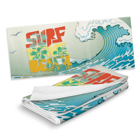 A full-colour sand-free towel featuring a wave design in blue and green with a surf theme. It has a logo.