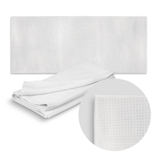 A white sand-free towel displayed flat with a close-up of its textured fabric, featuring a logo.