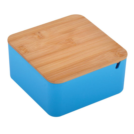 A square toiletry bag in bright blue with a natural bamboo lid and a small opening. It features a logo.