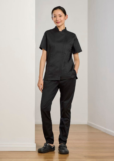 A black women's chef uniform featuring a short-sleeve top and jogger pants, paired with black clogs.