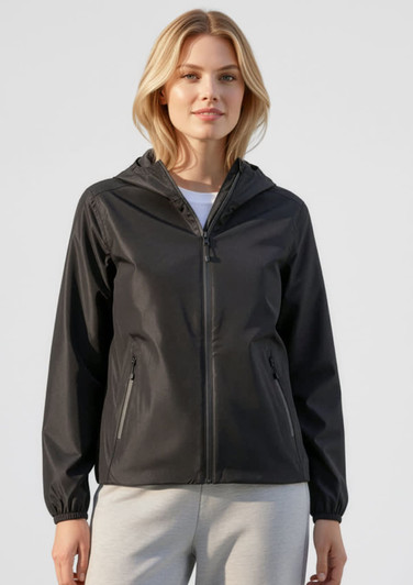 A woman models a black rain jacket, featuring a hood and zippers, with a simple design and side pockets.