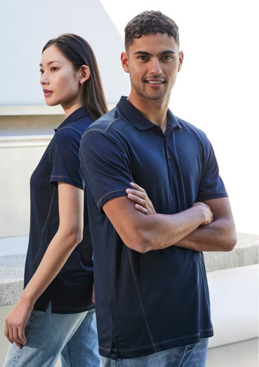 A navy short sleeve polo shirt featuring a classic collar and a logo, displayed by male and female models.