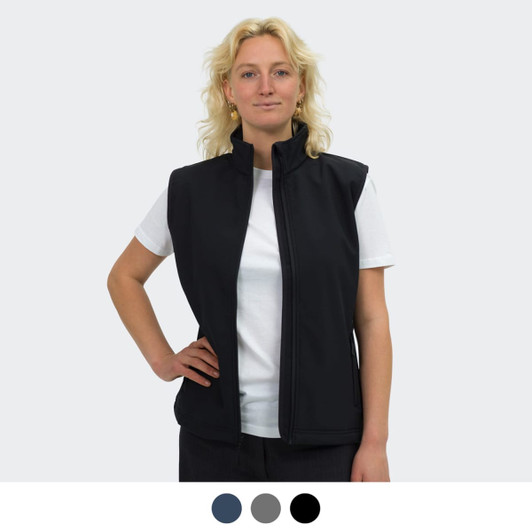 A woman models a black vest with a high collar, featuring a logo, paired with a white t-shirt.