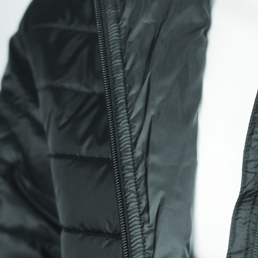 A black puffer jacket featuring a zippered front and quilted design, with a visible logo on the fabric.