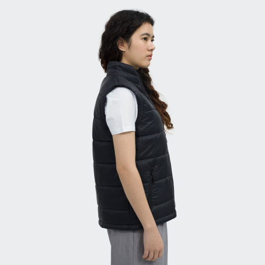 A women's puffer vest in black, featuring a collar and a side view of the model wearing it. It has a logo displayed.