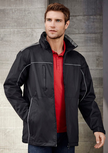 A black unisex jacket with white piping, featuring a zippered front and high collar. It has a logo on it.
