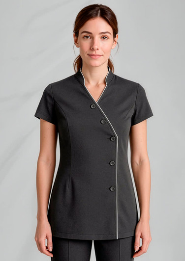 A short-sleeved women's crossover tunic in dark grey with white piping and a button detail, featuring a logo.