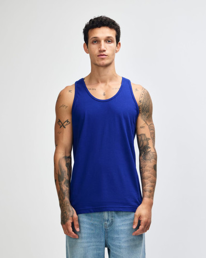 A blue unisex fine jersey tank top with a logo, displayed on a model against a plain background.