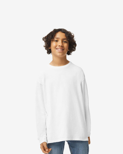 A youth wearing a white long sleeve T-shirt. The shirt has a logo on its front.