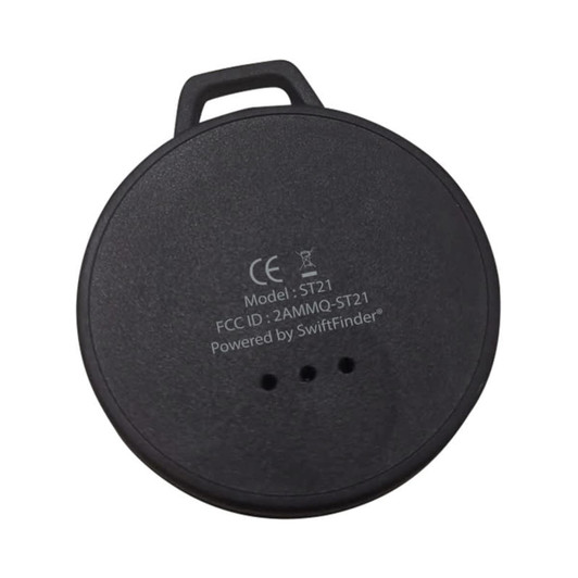 A black circular tracker device featuring a branding logo and three small indicator lights on the surface.
