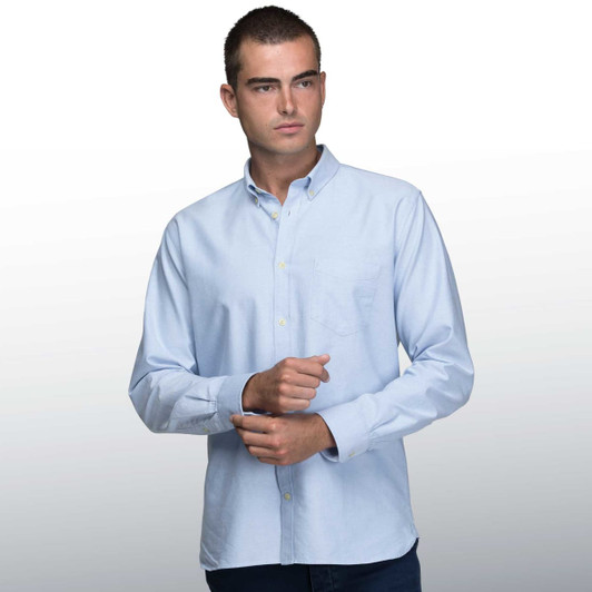 A light blue button-up shirt for men with a pocket and a logo.