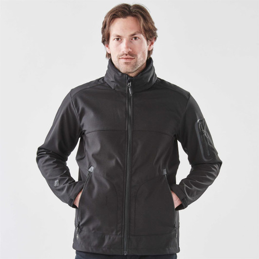 A men's softshell jacket in black, featuring a zippered front and pockets, with a logo on the sleeve.