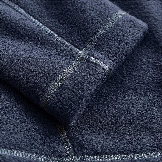 A close-up of a navy fleece jacket, highlighting the textured fabric and stitching details. It features a logo.